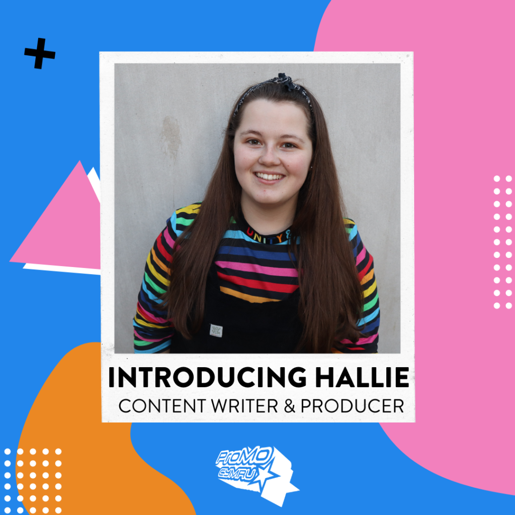 Image of Hallie new content writer and producer on the Kickstart scheme. Long brown hair, smiling face, rainbow striped jumper.