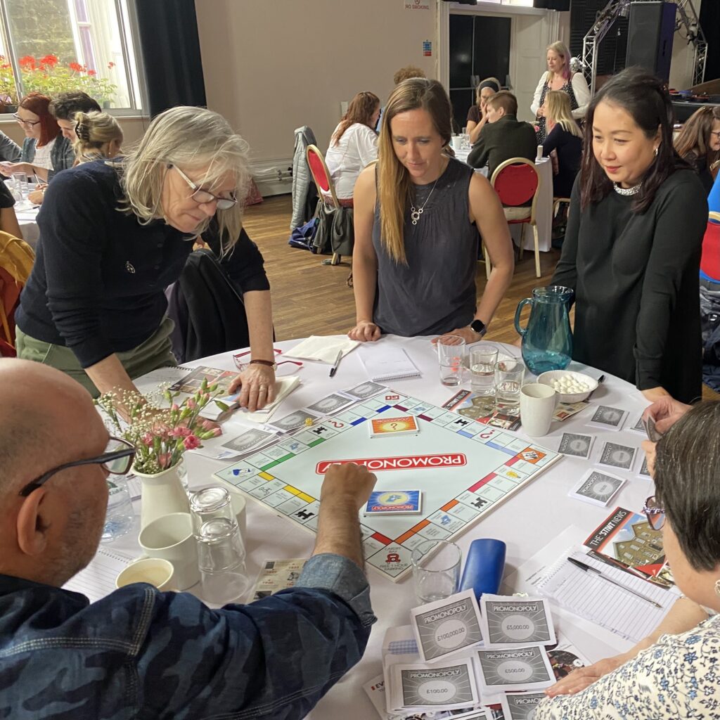 ProMo-Cymru staff playing ProMonopoly at their Imagining the Future Staff Days