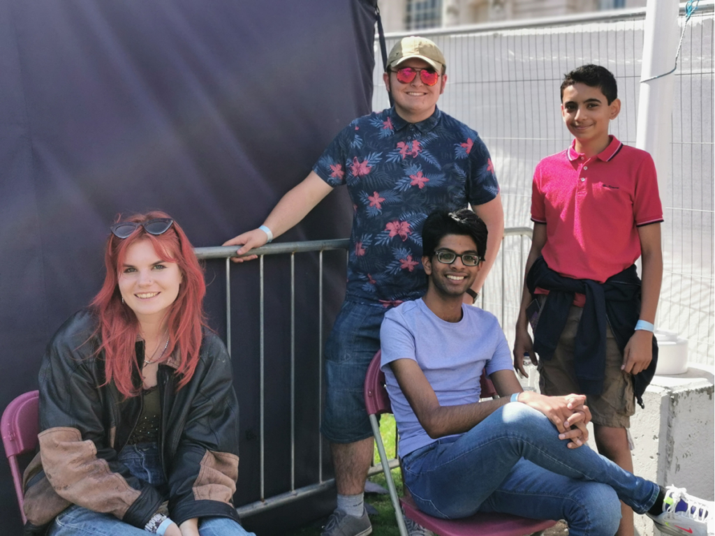 Group of young people smiling backstage. 