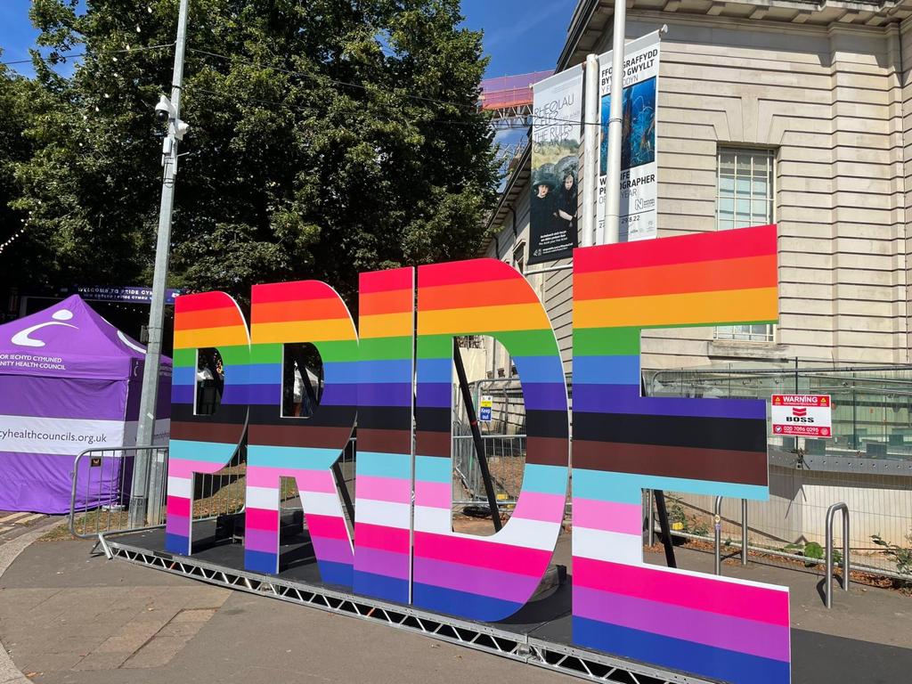 Colourful cardboard cut out with 'Pride' lettering